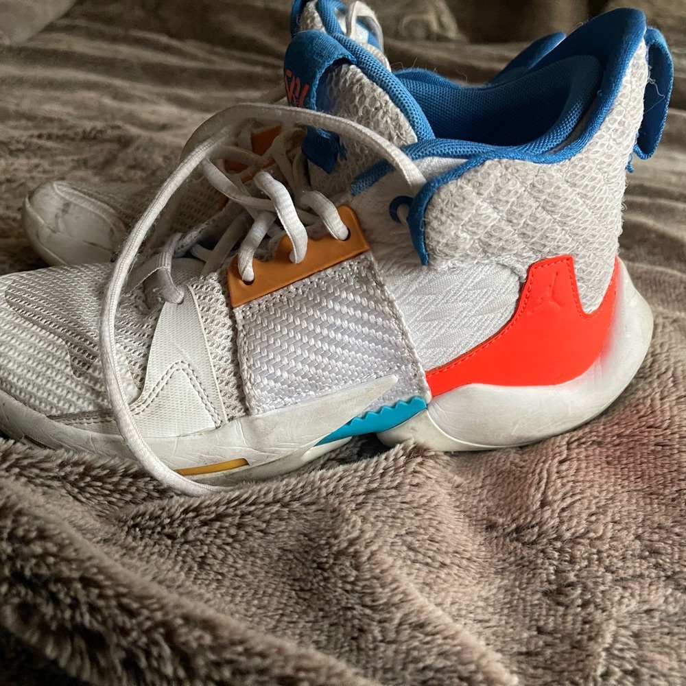 White and Red Athletic Sneakers with Vibrant Swoosh